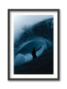 Framed artwork of a surfer silhouette riding a wave