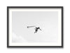 Framed black and white photograph of a surfer in mid-air